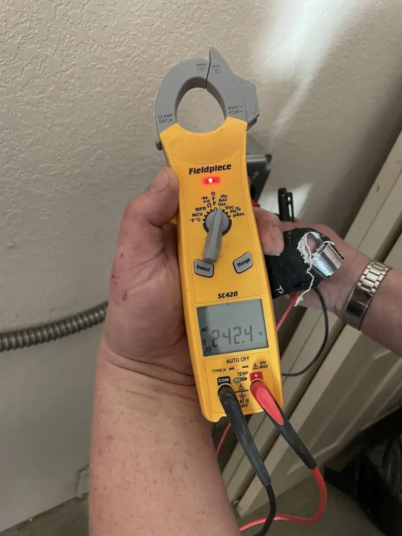 Voltage testing with clamp meter during Electrical Installation Services in Adams